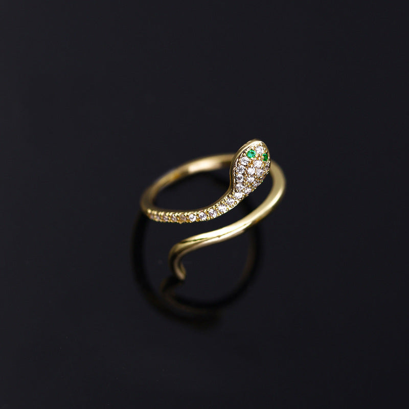 Close-up of sparkling zircon snake ring in gold