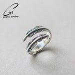 Elegant feather open silver ring, front view