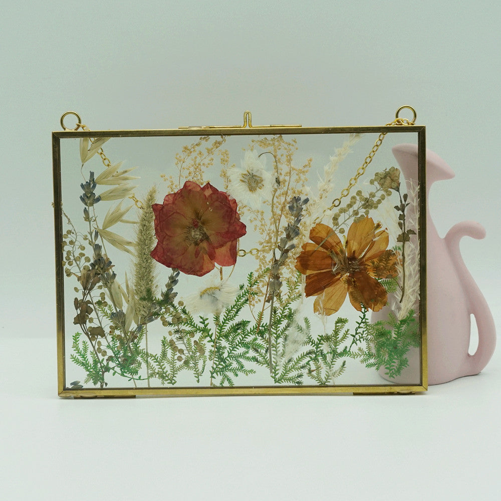 Close-up of eternal pressed bouquet in metal frame landscape design