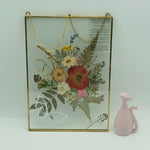 Eternal pressed bouquet in metal frame portrait, front view