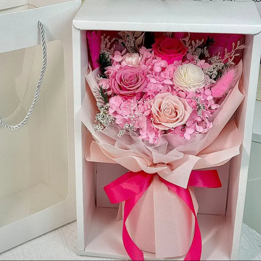 Fairy Light Eternal medium bouquet in blush, displayed in gift box