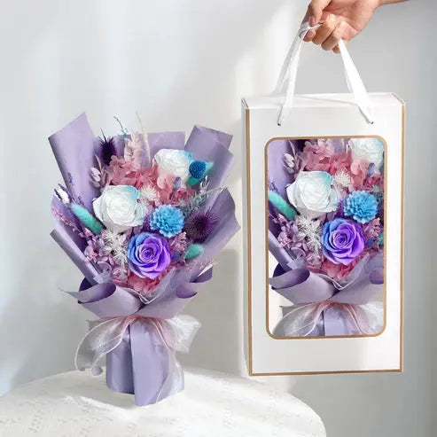 Fairy Light Eternal medium bouquet in purple, displayed in gift box