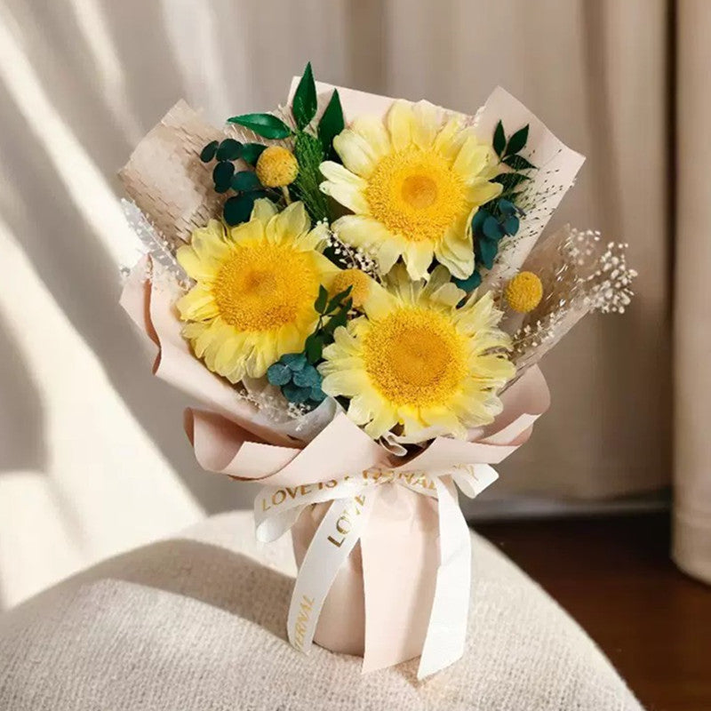 Fairy Light Eternal medium bouquet in sunflower, displayed in gift box on desk