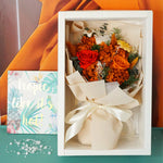 Fairy Light Eternal medium bouquet in vibrant color, displayed in gift box on desk