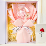 Fairy Light Preserved Flower Globe Gift Box open flat lay, featuring a pink preserved rose inside a clear globe wrapped in pink tissue paper with "Just for you" ribbon, nestled in shredded paper with warm fairy lights and a greeting card