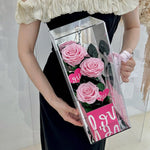 Luxury eternal pink rose in acrylic box gift, front view