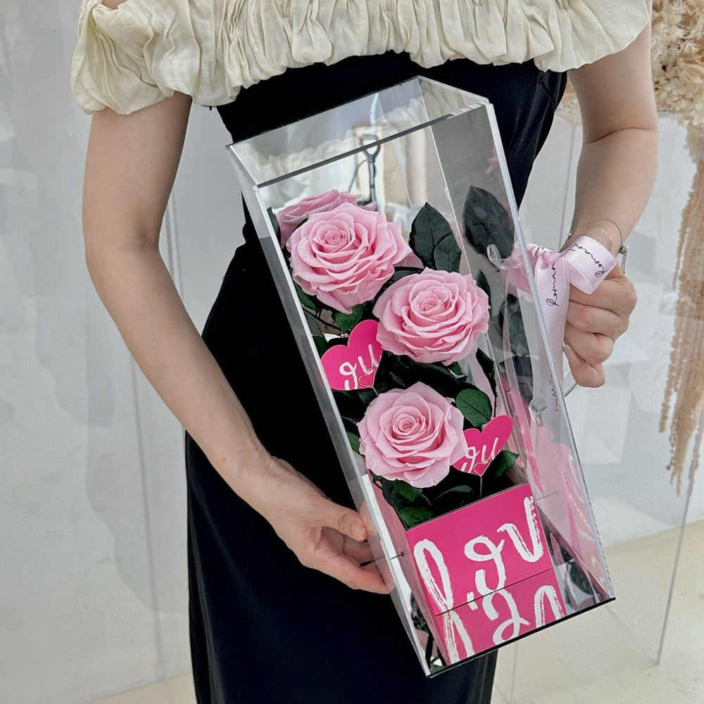 Luxury eternal pink rose in acrylic box gift, front view