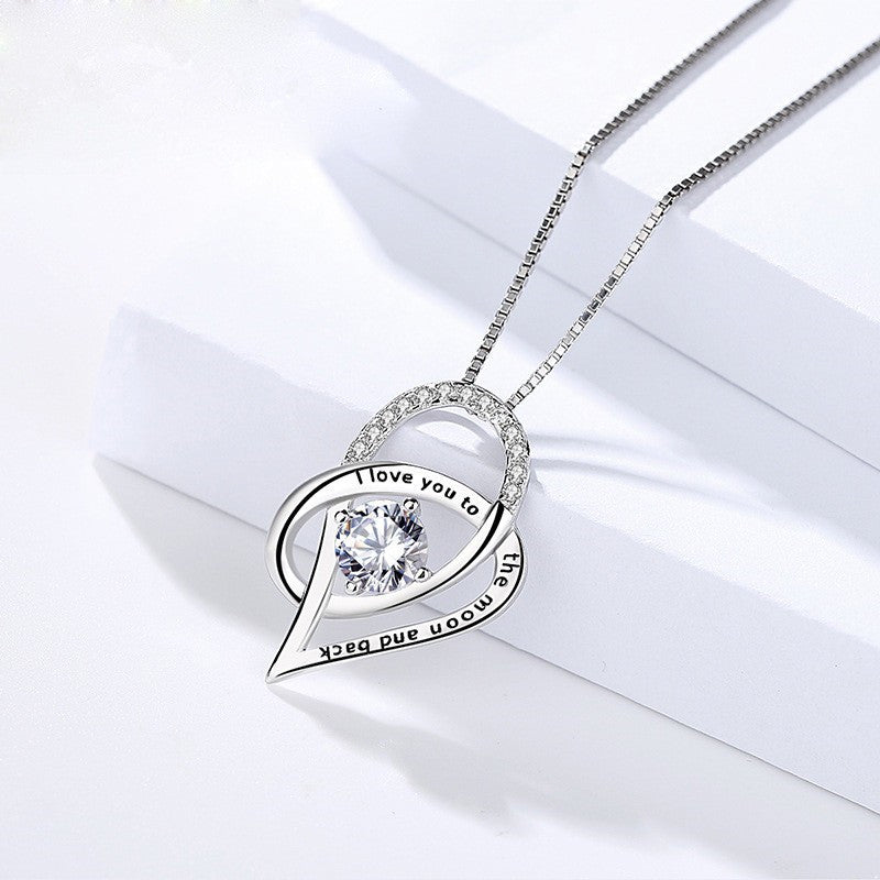 Close-up of Moon & Back sterling silver heart necklace design