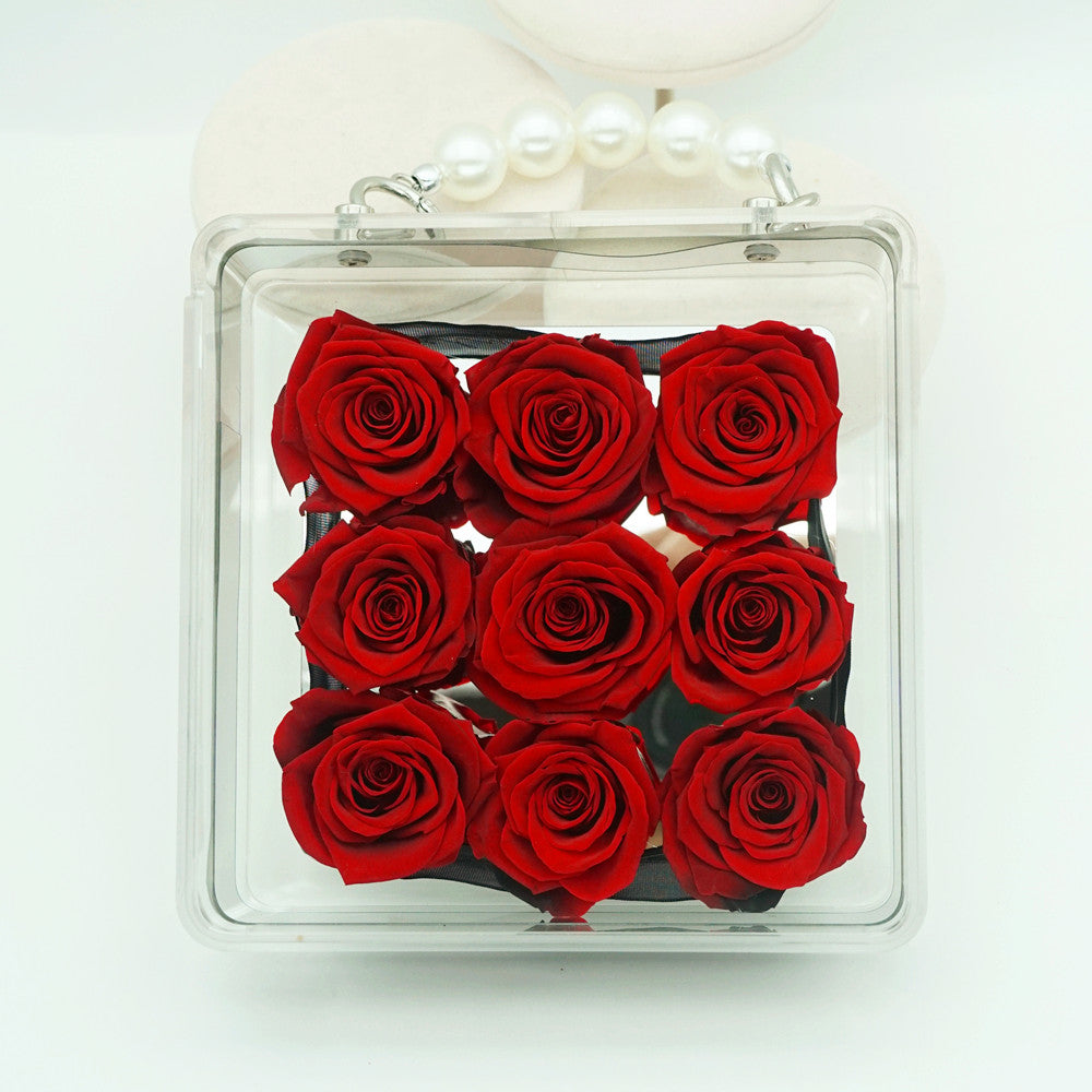 Petite eternal red rose in acrylic handbag gift box, front view