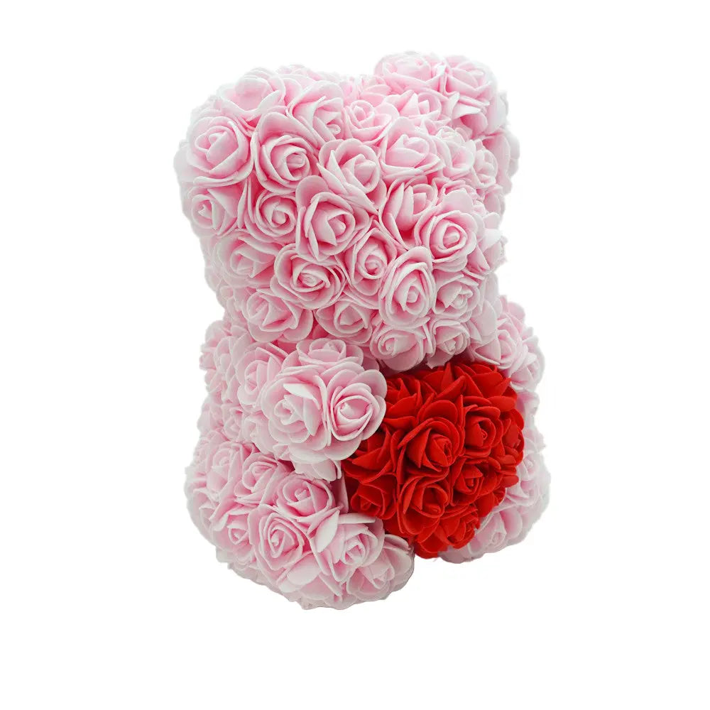 Close-up of pink rose bear with red heart, 25 cm