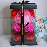 Rainbow mix rose bear, 25 cm, displayed in gift box on desk