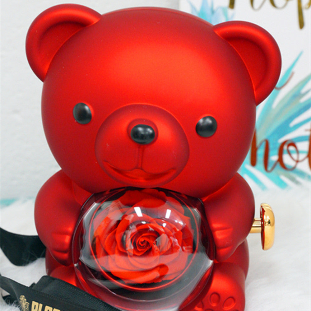 Close-up of red rotating eternal rose bear details