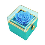 Close-up of blue  rotating eternal rose and jewelry gift box details