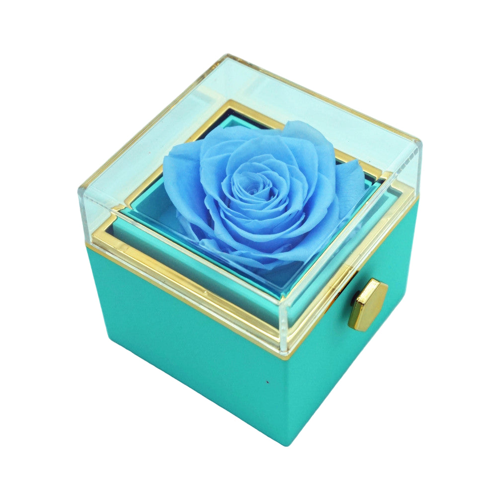 Close-up of blue  rotating eternal rose and jewelry gift box details