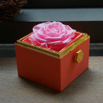 Close-up of blue rotating eternal rose and jewelry gift box details