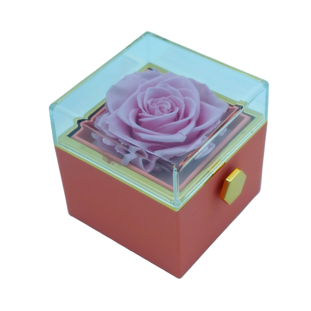 Close-up of pink rotating eternal rose and jewelry gift box details