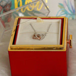 Back view of red rotating eternal rose and jewelry gift box showing jewelry display