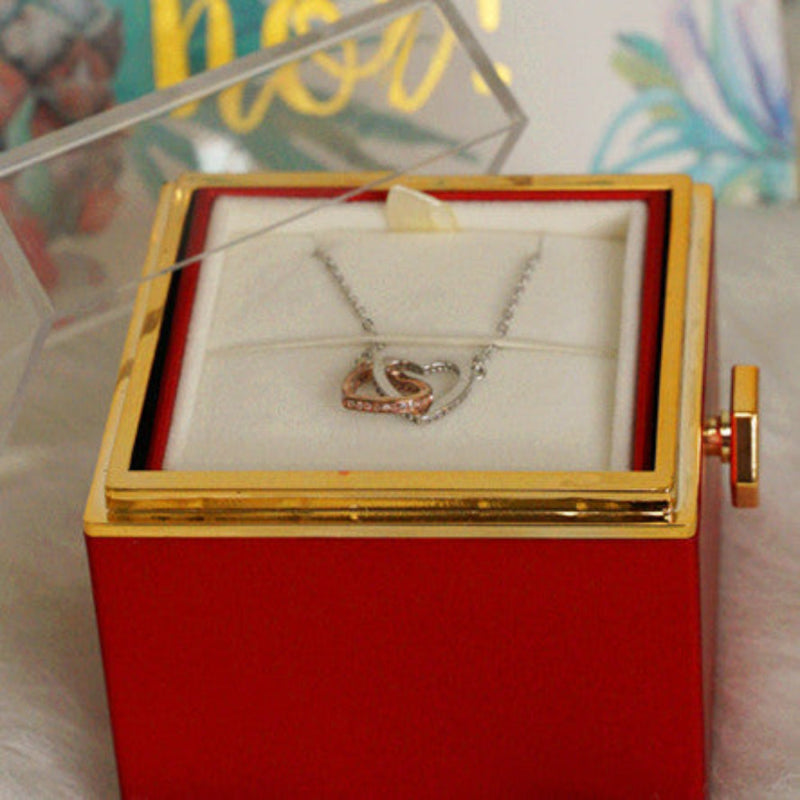 Back view of red rotating eternal rose and jewelry gift box showing jewelry display