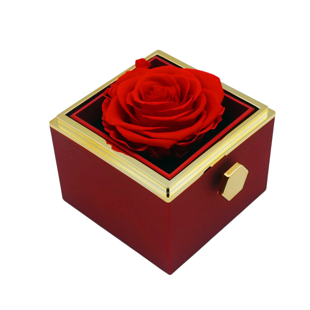 Close-up of red rotating eternal rose and jewelry gift box details