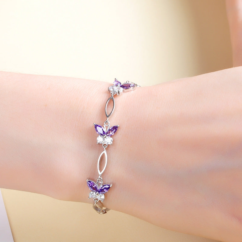 Close-up of sparkling butterfly zircon silver bracelet design