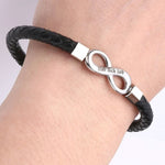 Close-up of trendy 8-shaped men’s leather bracelet