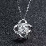 Close-up of trendy openwork four-leaf clover necklace design